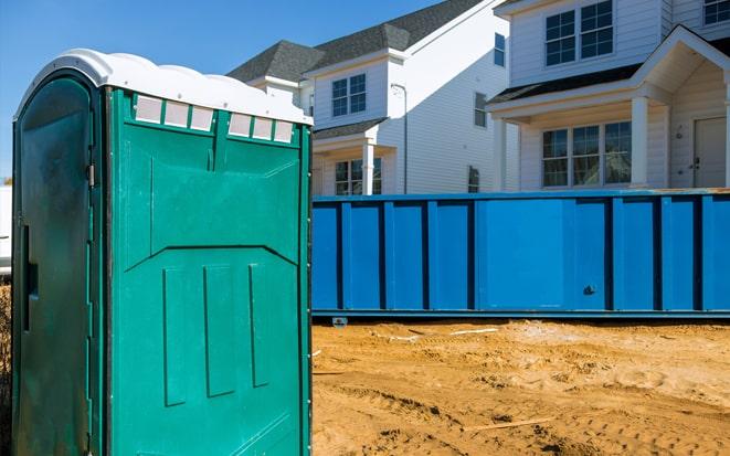 portable toilet and dumpster at a construction site project in East Brunswick NJ